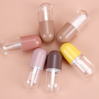 Vente en gros de mini tubes à gloss à lèvres créatifs en forme de pilule, avec bouchon blanc, emballage en capsule, tube à gloss à lèvres vide