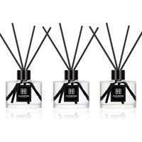 Ensemble cadeau diffuseur de parfum d'ambiance rond transparent personnalisé avec logo imprimé, bouchon noir, ruban, bâtonnets en rotin, boîte cadeau noire, parfum d'ambiance de luxe