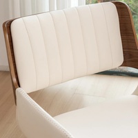 Fauteuil de salle à manger pivotant Brayven moderne en similicuir fait main avec pieds en bois, structure en bois massif écologique et structure en tube métallique