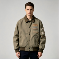 Veste de travail en toile de coton lavée pour homme OEM, avec plusieurs patchs en chenille, col en velours côtelé, style streetwear, veste bomber décontractée pour homme