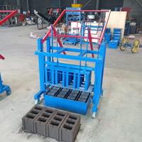 Mini fabricant de blocs de machine de fabrication de briques en béton de ciment manuel électrique avec composant de noyau de moteur