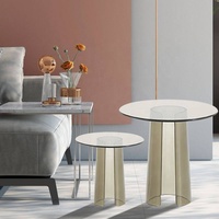 Table basse ronde élégante de style nordique moderne avec plateau en verre trempé et support en acrylique, design italien