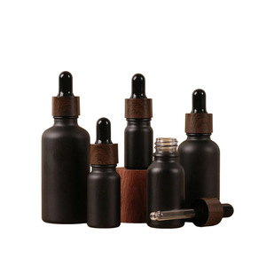 Botella de vidrio negro mate cilíndrica de lujo al por mayor de 5-100ml con gotero y collar de vidrio negro para aceite facial y <span class=keywords><strong>perfume</strong></span> - Product Image 1
