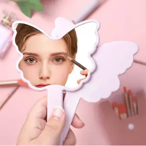 SAIYII recién llegado lindo espejo de mano de viaje de plástico en forma de mariposa Rosa Etiqueta Privada espejo de mano cosmético con mango
