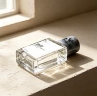 Bouteille de parfum vide en verre transparent de 100 ml avec étiquette personnalisée, paroi épaisse, épaule plate, forme rectangulaire carrée, avec bouchon en marbre