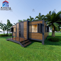Module d'extension de maison conteneur extensible et peu encombrante avec solutions de rangement dissimulées et mobilier rétractable