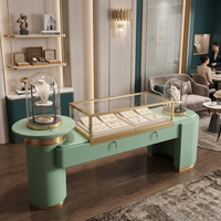 OEM Glaskuppel Moderne Mintgrüne Schmuckladeneinrichtung Ausstellungstheke Halskettenständer LED-Vitrine Boutique-Ladenschrank