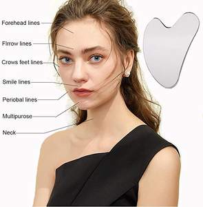 Aço inoxidável coração forma facial uasha pad logotipo privado impresso rosto perna mão corpo massageador - Product Image 3