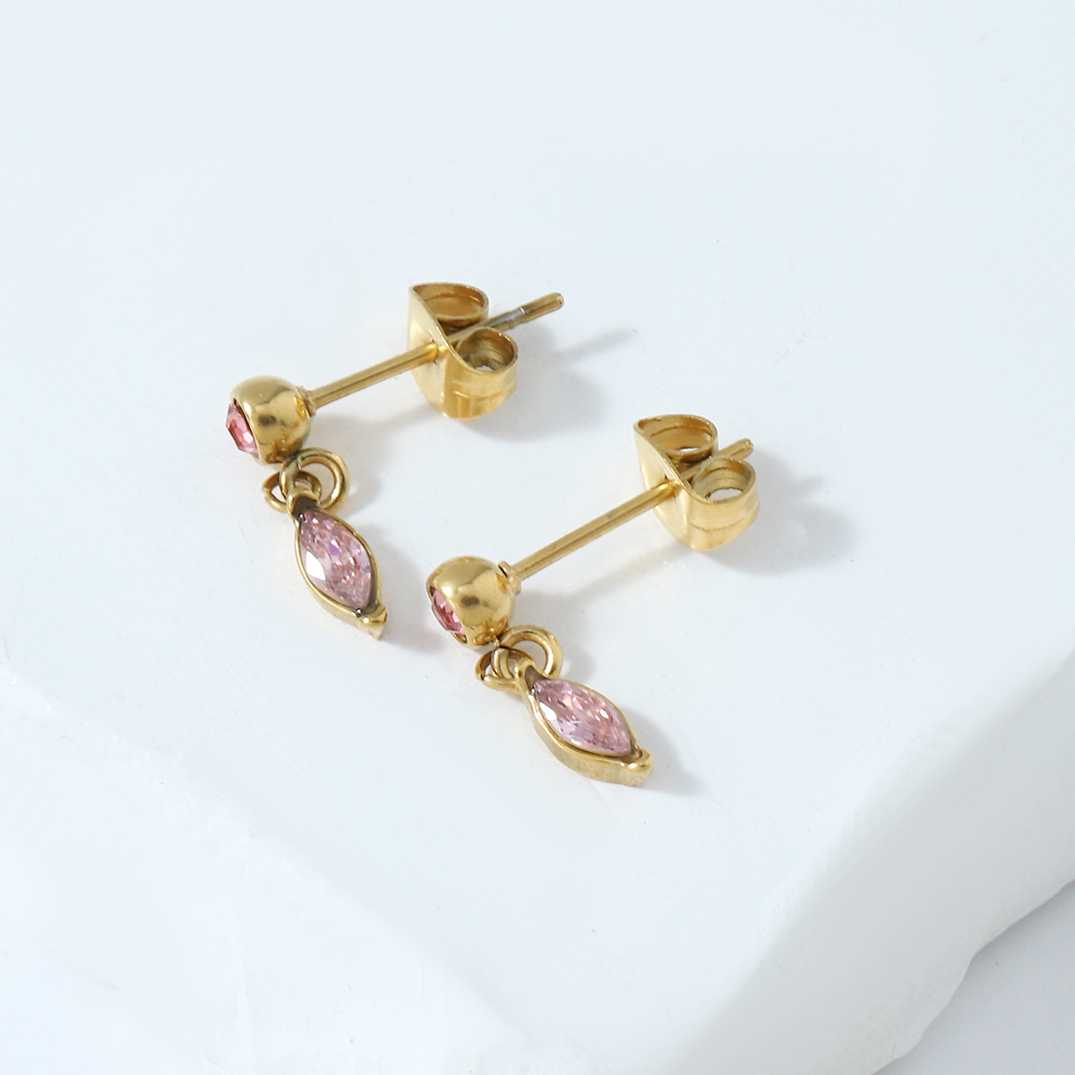 green enamel stud earring with emerald