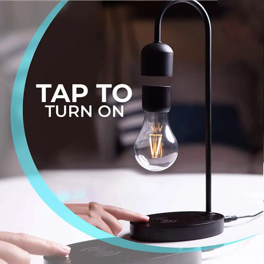 रचनात्मक संतुलित चुंबकीय उत्तोलन अस्थायी प्रकाश बल्ब डेस्क रात दीपक के साथ मोबाइल फोन वायरलेस चार्ज समारोह