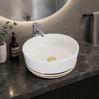 Lavabo rond en céramique de luxe moderne avec lignes dorées, vasque à poser en porcelaine pour projet hôtelier