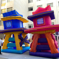 Modèle de tour gonflable décorative Alice des Merveilles, maison sur échasses pour carnaval, festival, publicité en centre commercial, autres événements