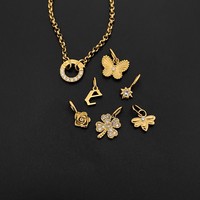 Bracelet chaîne Rolo eManco en acier inoxydable avec breloques papillon, lettre E, rose, étoile, abeille, trèfle à quatre feuilles et cristaux