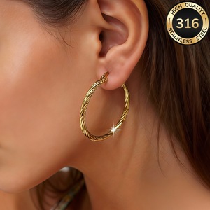 Pendientes exclusivos transfronterizos de acero inoxidable, con diseño de espiral exagerada, chapados en oro de 18K, elegantes para mujer. - Product Image 1