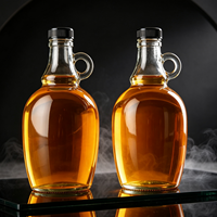 Botella de vidrio vacía al por mayor estilo California de 500ml, 1000ml, 1500ml, 2000ml, 3000ml, 4000ml para whisky, licores y vino con asa