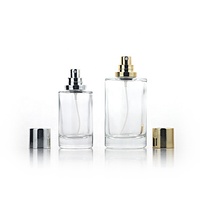 Venta al por mayor 30ml 50ml 100mL botella de perfume de vidrio transparente redonda con tapa plateada