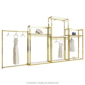 Butik için özel paslanmaz çelik bez ekran standları kadın kıyafetleri ekran rafları Metal perakende butik altın kıyafet rafı