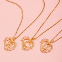 Collier léger de luxe à motif floral et lettre en forme de cœur pour femme, chaîne de clavicule unique et élégante