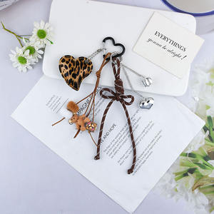 Nouveau arc en cuir amour boule alliage cent <span class=keywords><strong>auto</strong></span>-<span class=keywords><strong>stoppeur</strong></span> porte-clés sac décoratif personnalité suspendus ornements - Product Image 5