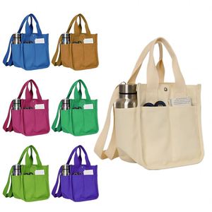 Sac fourre-tout en toile beige avec poches latérales pour bouteille d'eau et bouton-pression pour le bureau, les pique-niques et le transport de repas bento - Product Image 3