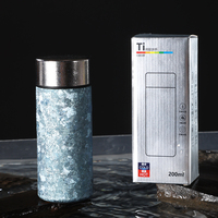 Petite bouteille d'eau thermos en métal de 200ml Mini bouteille de poche isolée double couche de 200ml Bouteille en titane pur
