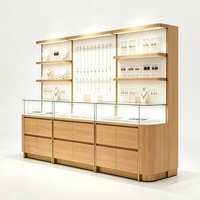 Vitrine de présentation de bijoux moderne et attrayante avec éclairage LED, dimensions personnalisables pour les magasins de détail de bijoux