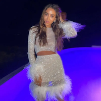 Mini jupe Sexy de fête pour femmes, robe en maille avec plumes d'autruche et strass élastique