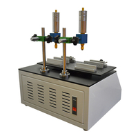 Testeur automatique de résistance à l'usure par l'alcool, utilisé pour les tests en laboratoire, pour évaluer la résistance aux rayures et à l'abrasion des produits enduits
