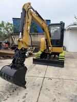 Mini-excavatrice sur chenilles Caterpillar 303.5 d'occasion, faible kilométrage, moteur diesel, compacte, testée en ferme, vidéo disponible
