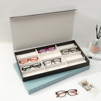 Boîte de présentation haut de gamme en cuir pour lunettes et lunettes de soleil, 12 compartiments, avec fermeture magnétique, design multi-grilles, grande capacité de rangement