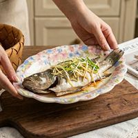 Assiette ovale en céramique de haute qualité pour plats de poisson vapeur, cuisine occidentale américaine, desserts aux fruits, idéale pour la maison et l'hôtellerie
