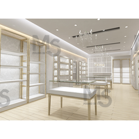 Vitrine de bijoux en verre moderne de luxe Comptoir en bois éclairé par LED pour jouet Whisky Curio Cabinets pour magasin Design d'intérieur utilisé