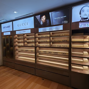 Magasin de vente au détail optique contemporain avec étagères ouvertes à niveaux et vitrines rondes éclairées - Product Image 5