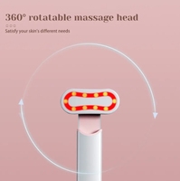 Masseur oculaire rotatif à lumière rouge avec microcourant, vibration et chauffage pour les cernes et le massage facial