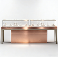 Comptoir de présentation de bijoux LED en or rose de luxe avec dimensions personnalisables, vitrine en verre durable pour les bijouteries et les centres commerciaux