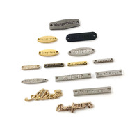 Accessoires de vêtements de Offre Spéciale directe d'usine bord découpé au Laser couture métal plaques signalétiques en alliage de Zinc chaînes d'étiquettes creuses