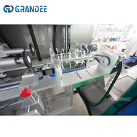 Appareil d'étiquetage automatique de haute précision pour bouteilles et canettes, applicateur de manchons thermorétractables en PVC pour bouteilles