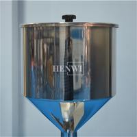 Machine de remplissage liquide manuelle Henwi A01 One Nose 5-50ml pour petites bouteilles d'huile essentielle, de parfum et de sérum.