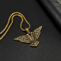 Colliers pendentifs en acier inoxydable tendance hip-hop punk créatif à double tête d'aigle religieux pour hommes en gros