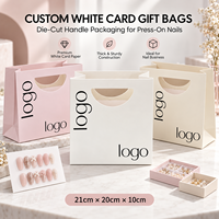 Sacs cadeaux personnalisés en papier cartonné blanc 21cm x 20cm x 10cm avec poignée découpée pour faux ongles et emballage de salon de manucure
