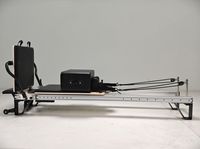 Machine de Pilates Reformer en alliage d'aluminium noir durable, portable, réglable et écologique pour la maison et les studios de Pilates