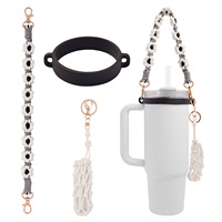 Expédition rapide |   Sangle pour bouteille d'eau en forme de fleur tissée à la main couleur macaron, cordon de transport pour tasse isotherme