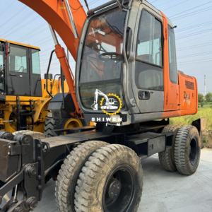 Originele verf <span class=keywords><strong>Hitachi</strong></span> ZX130W gebruikte graafmachine wielgraafmachine met bulldozerblad <span class=keywords><strong>Hitachi</strong></span> ZX135 <span class=keywords><strong>ZX150</strong></span> ZX200 ZX220 lage prijs - Product Image 3