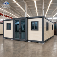 Maison modulaire extensible à double aile de 20, 30 ou 40 pieds avec porte d'entrée centrale en verre pour maison-conteneur de jardin