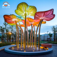 Sculpture géante personnalisée en métal en forme de feuille de lotus, lumineuse et durable, pour l'aménagement paysager extérieur de Noël, idéale pour les places municipales et les sites touristiques.