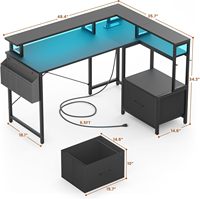 Bureau d'angle moderne en forme de L pour jeux et usage commercial avec éclairage LED, prises de courant, grande étagère d'angle pour imprimante et tiroir de rangement