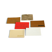 Étiquettes personnalisées en cuir PU écologique thermocollées pour jeans, accessoires de vêtements à coudre, vente en gros, OEM, faible MOQ