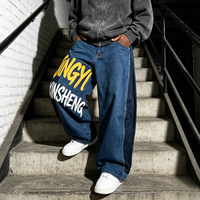 Jean en denim pour homme, coupe baggy à jambe large, avec broderie de patch personnalisée, imprimé et patchwork color block, par un fabricant de denim