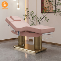 Table faciale de massage électrique pliante rose de luxe avec 4 moteurs et cadre en acier inoxydable