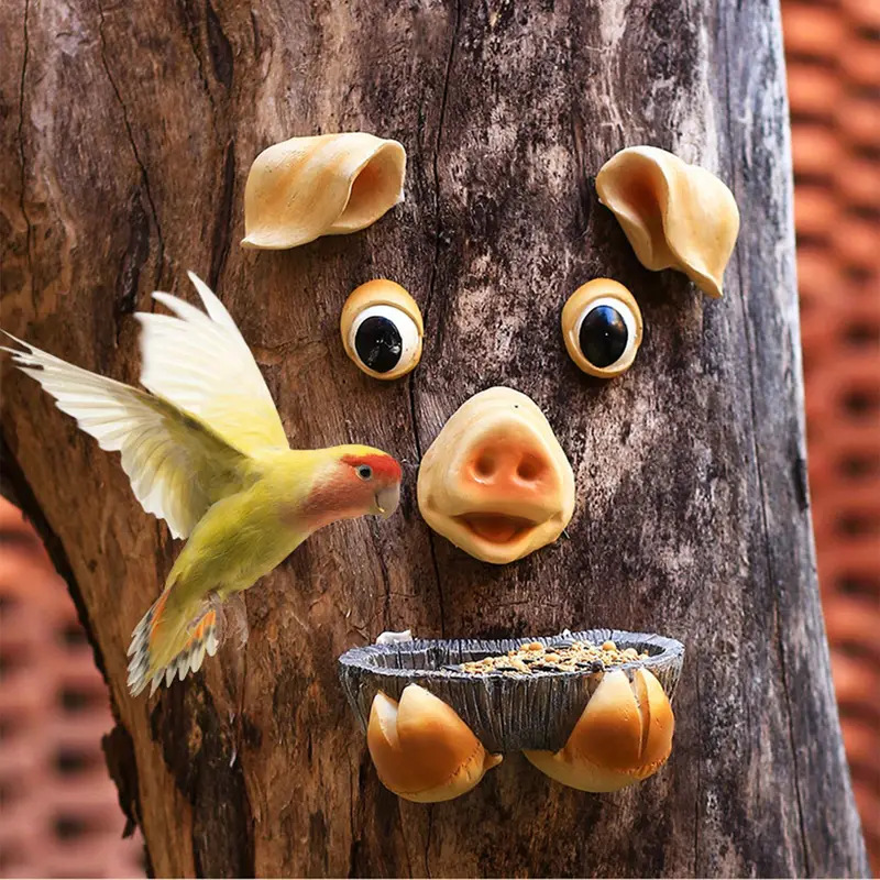 Mangeoire à oiseaux en forme de visage d'arbre de cochon